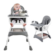 Baby in a gray high chair with a tray, sitting on a white background