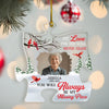 Personalized Christmas ornament with a photo of an elderly woman, red birds, and text on a blurred Christmas tree background.