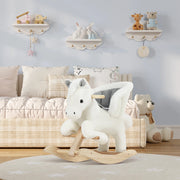 Children's room with a rocking horse, teddy bears, and shelves with toys.